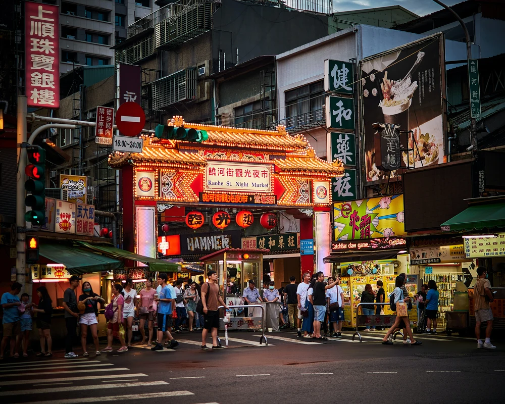 People walking on the streets of Taiwan at night