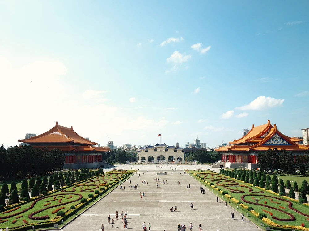 People walking towards the entrance of a temple