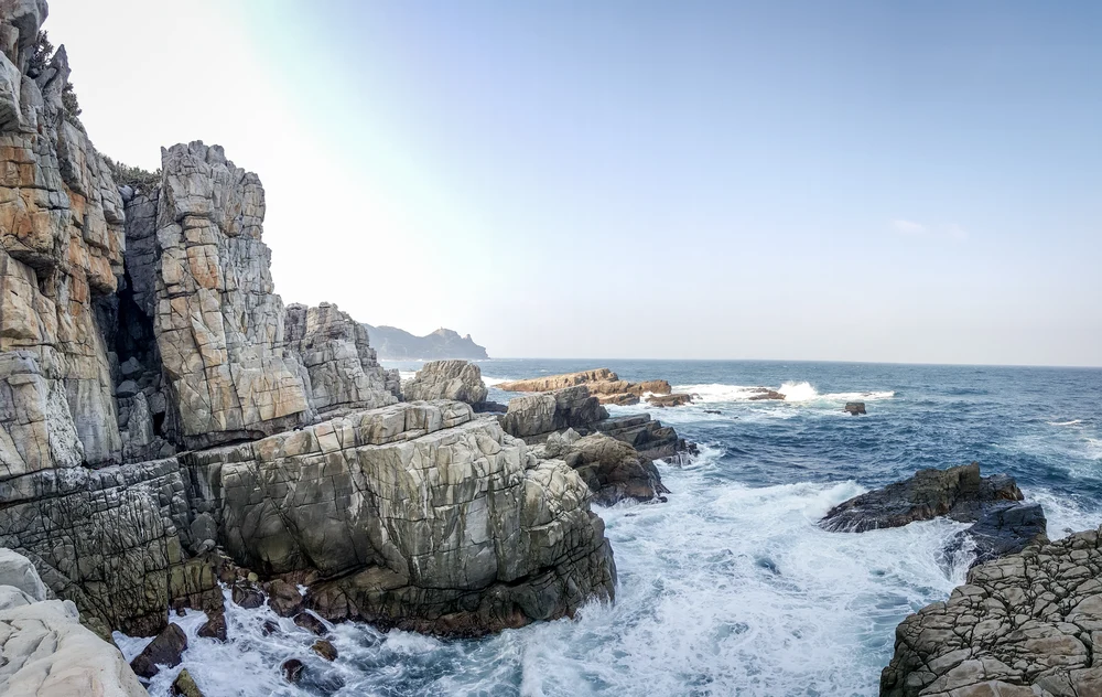 Rock formations by the blue sea